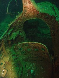 Cockpit of a Japanese Zero fighter in the forward hold on the Fujikawa Maru...